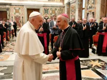 Pope Francis greets Archbishop Rino Fisichella in the Vatican's Clementine Hall, Sept. 17, 2021.
